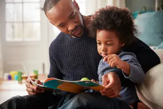 Dad reading to kid