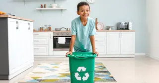 Kid with recycling bin
