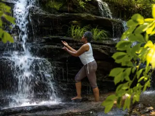 Women enjoying a waterfall