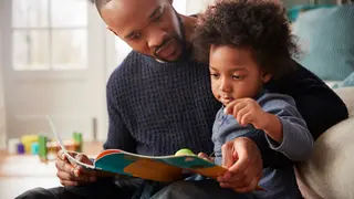 Dad reading to kid