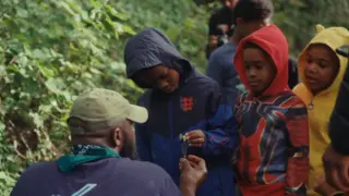 Kids learning forest science in the woods